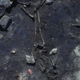 Inside House 40, a youth with feet lying over the midsection of an adult